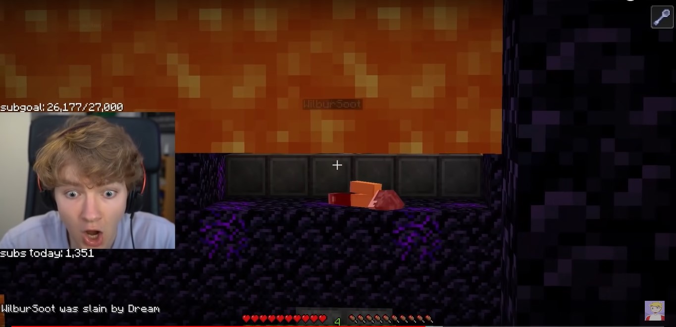 A screenshot from Tommy's stream. Ghostbur is standing on the ledge outside of Dream's cell, killed and falling over. The lava covers the majority of the screen, but it hasn't fallen yet to cover the gruesome scene. A death message sits in the game chat, 'WilburSoot was slain by Dream'. Tommy's facecam is full of shock and horror.